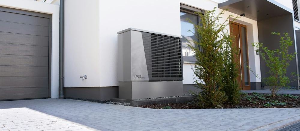 A heat pump unit outside a modern home